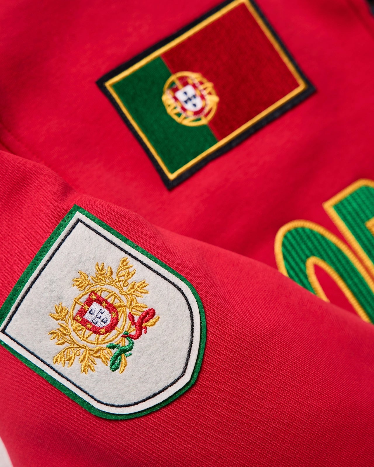 The Pitch World Jacket - Pitch Red/Portugal