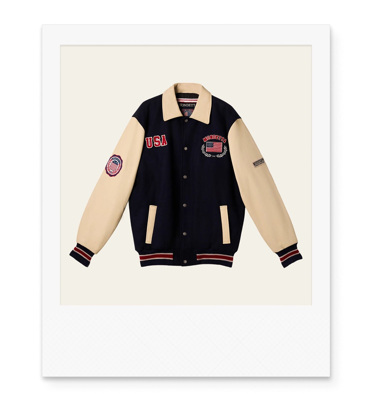 Two-tone black and beige varsity jacket with USA and flag designs on the front and arm patches.