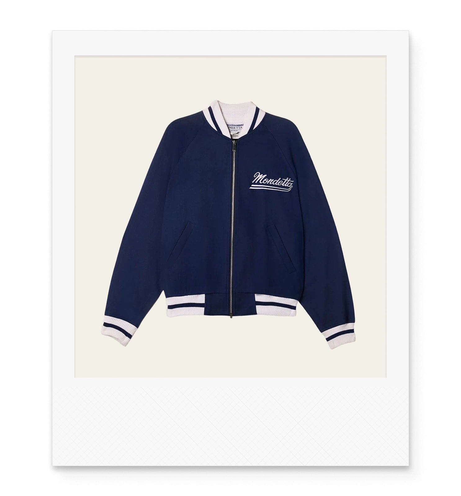 Navy blue track jacket with Mondetta on the front left chest with white and navy stripe cuffs and trim.